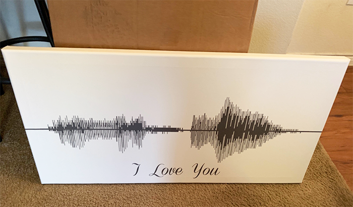 Sound Wave Art Canvas by Canvas Vows. Canvas laying by the wall.